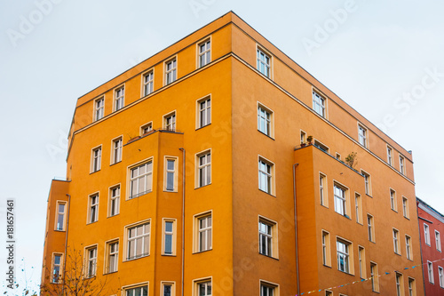 orange facaded apartment complex in block form