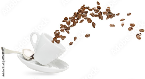 coffee beans spilling out of a cup isolated on white