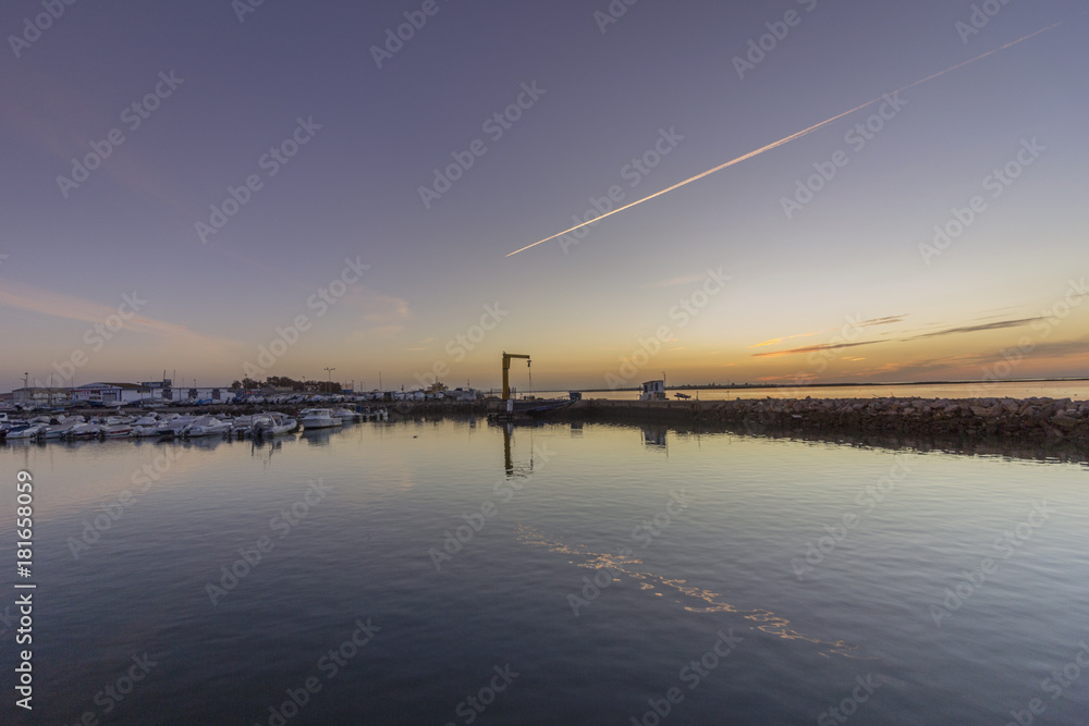 Dawn view of Olhao Recreational Marina, waterfront to Ria Formosa natural park. Algarve.