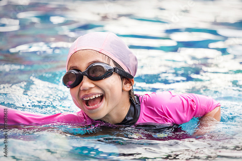 Soft focus children girl in swimming pool © thechatat