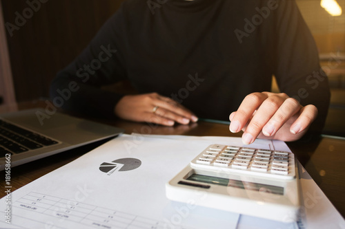 financial auditor work calculator analyzing data documents
