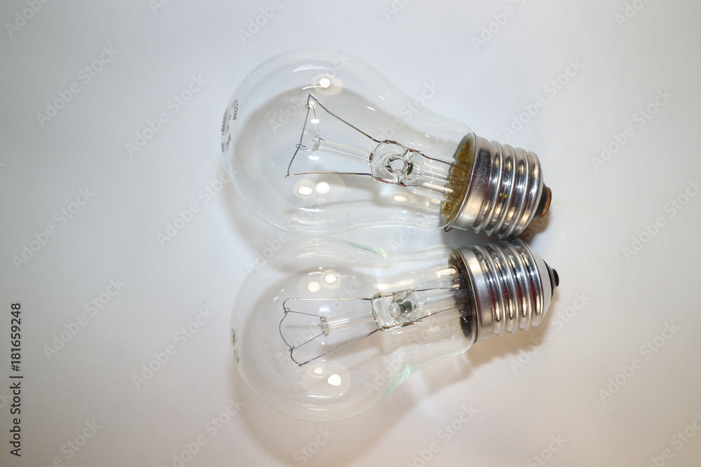 two incandescent lamps close-up on a white background two incandescent lamps close-up on a white background