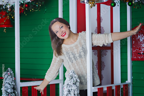 Wallpaper Mural Young woman in Christmas decorated porch. Torontodigital.ca