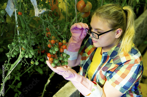 Girl working in a greenhouse