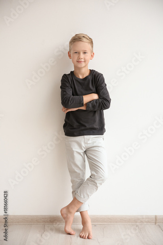Cute little boy standing ne...