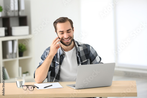 Attractive man with laptop ...