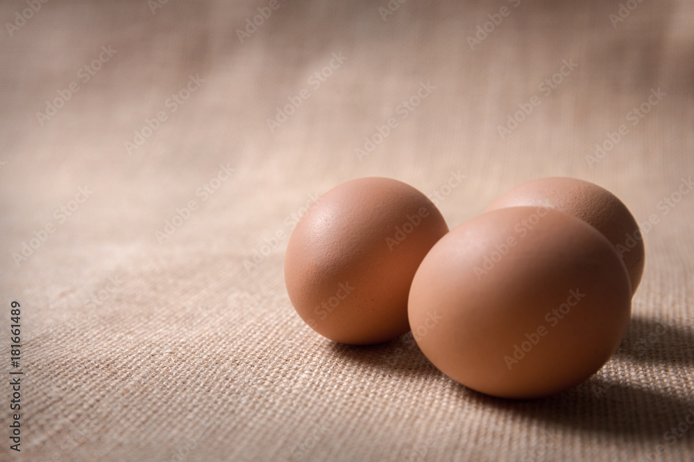 Fresh organic eggs on sackcloth(gunny) with copy space for text Fresh organic eggs on sackcloth(gunny) with copy space for text