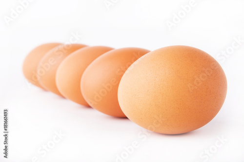 Five eggs are isolated on a white background
