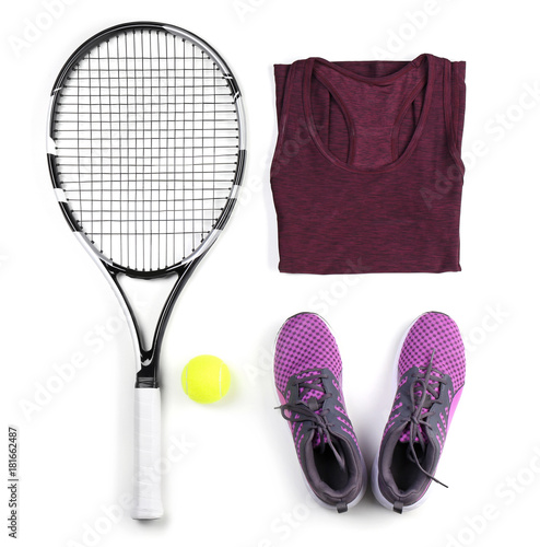 Tennis racket, ball, clothes and shoes on white background