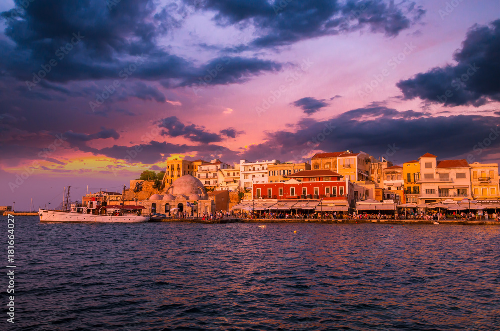 Stunning sunset view of the old venetian port of Chania on Crete island, Greece.