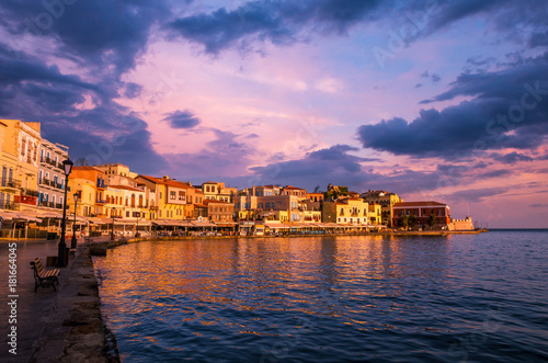 Stunning sunset view of the old venetian port of Chania on Crete island, Greece.