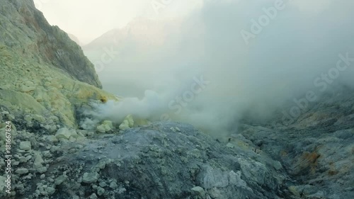 Kawah Ijen, crater with acidic crater lake the famous tourist attraction, where sulfur is mined. Aerial view of Ijen volcano complex is a group of stratovolcanoes in the Banyuwangi Regency of East photo