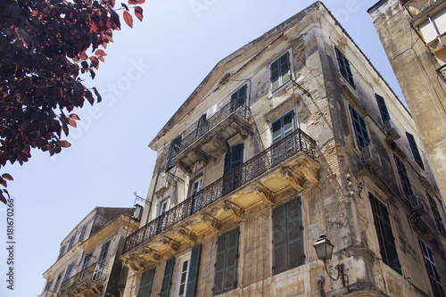 Old, historical buildings in Corfu (Kerkyra) town. It's an island of Greece’s northwest coast in the Ionian Sea. Cultural heritage reflects years spent under Venetian, French and British rule.