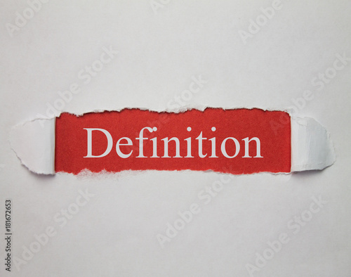 Definition word on a torn paper. photo