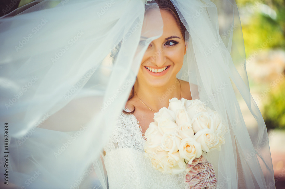 Naklejka premium tender happy bride in veil, happy woman in wedding dress with bouquet in hands, white veil covers face, gentle and warm