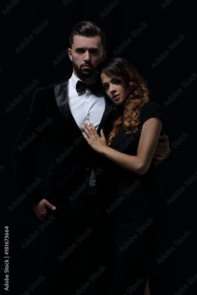 portrait of fashion couple on black background portrait of fashion couple on black background