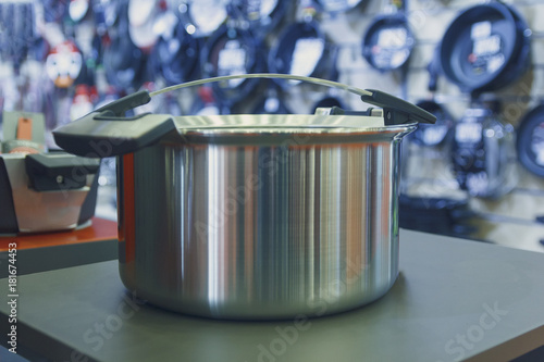 Stainless steel pot on the store shelf. Retail sales