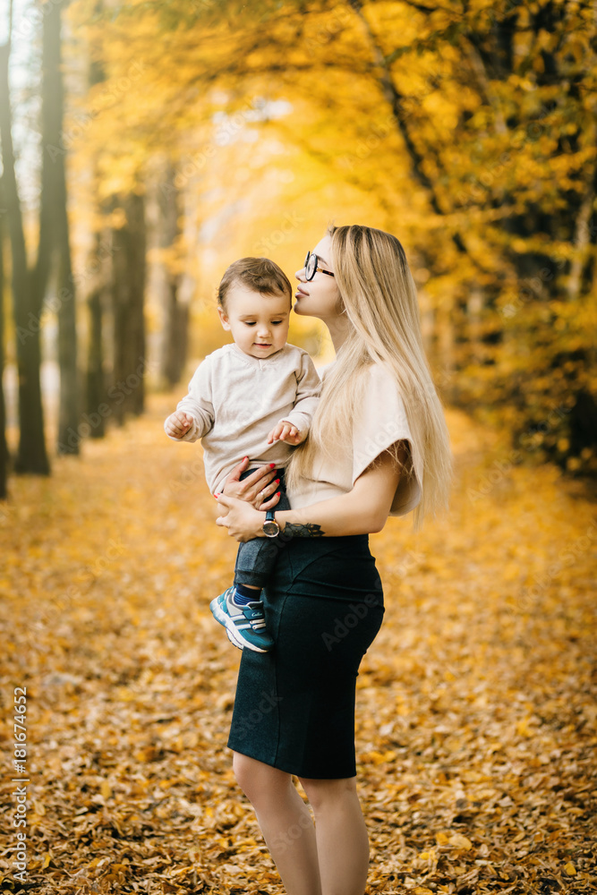 Young mother rising baby up Young mother rising baby up