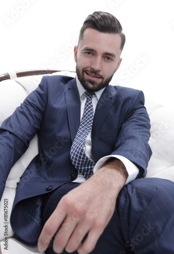 confident businessman sitting in a chair
