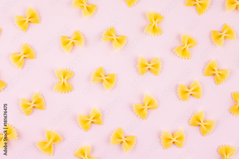 Pattern made of pasta on pink background. Flat lay. Minimal concept Pattern made of pasta on pink background. Flat lay. Minimal concept