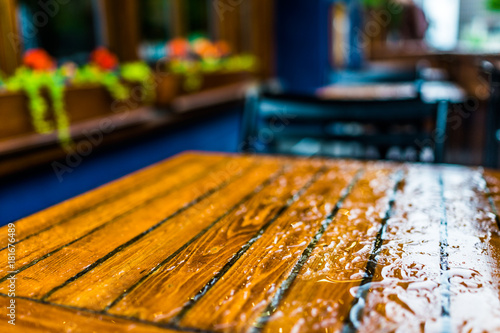 Wet table closeup outside restaurant during heavy rain