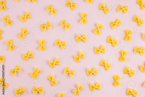 Pattern made of pasta on pink background. Flat lay. Minimal concept