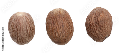 Three nutmeg whole isolated on white background. Top view