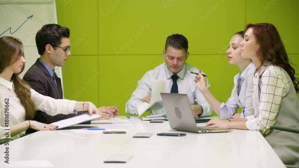 Chief speak positive speech to his business work team and shake hand to the partner because of success deal and sign contract, during business meeting in modern green office room Chief speak positive speech to his business work team and shake hand to the partner because of success deal and sign contract, during business meeting in modern green office room