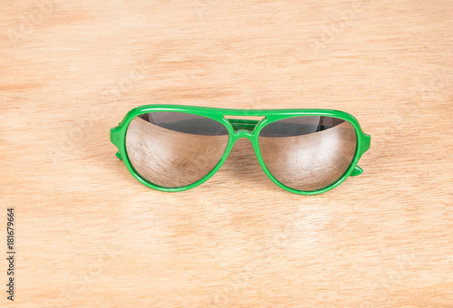 glasses green on the wooden background