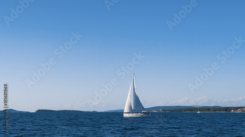 Fototapeta Naklejka Na Ścianę i Meble -  Sailing. Ship yachts with white sails in the Sea. Luxury boats. Boat competitor of sailing regatta.