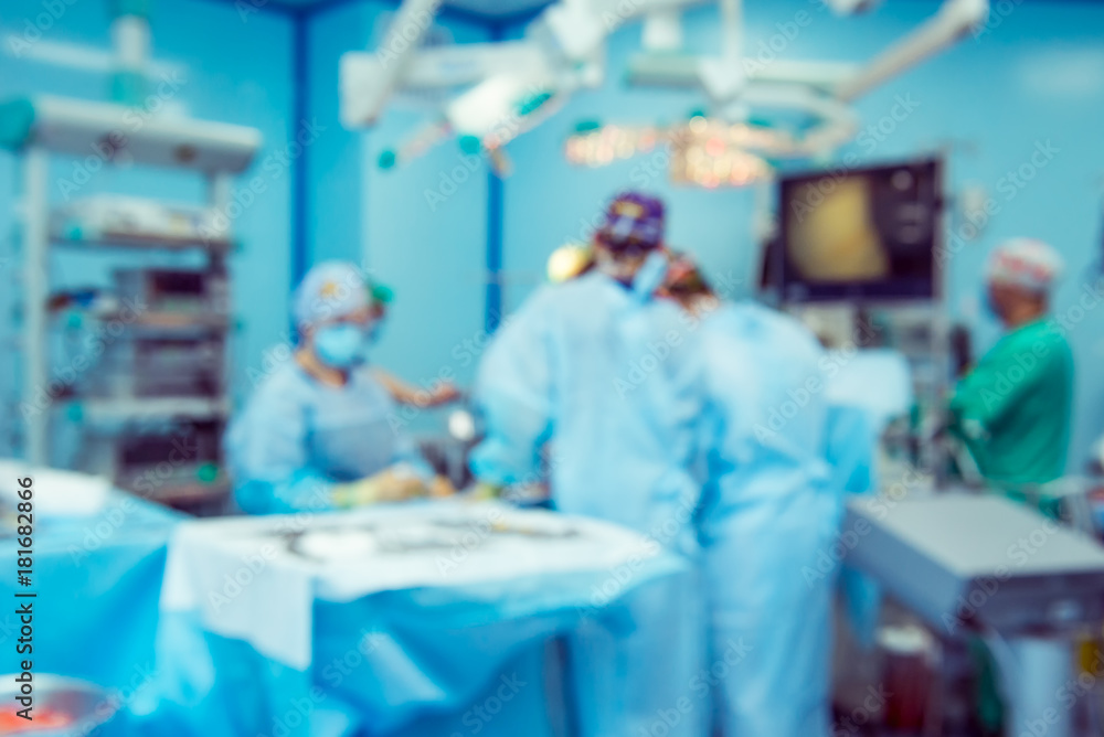 Blurred background with team surgeon at work with laparoscopic equipment in operating room. Blurred background with team surgeon at work with laparoscopic equipment in operating room.