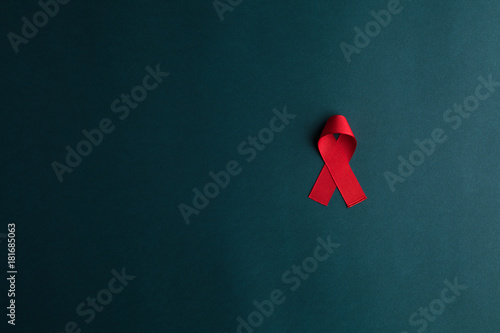 aids red ribbon on blue background, hiv ribbon
