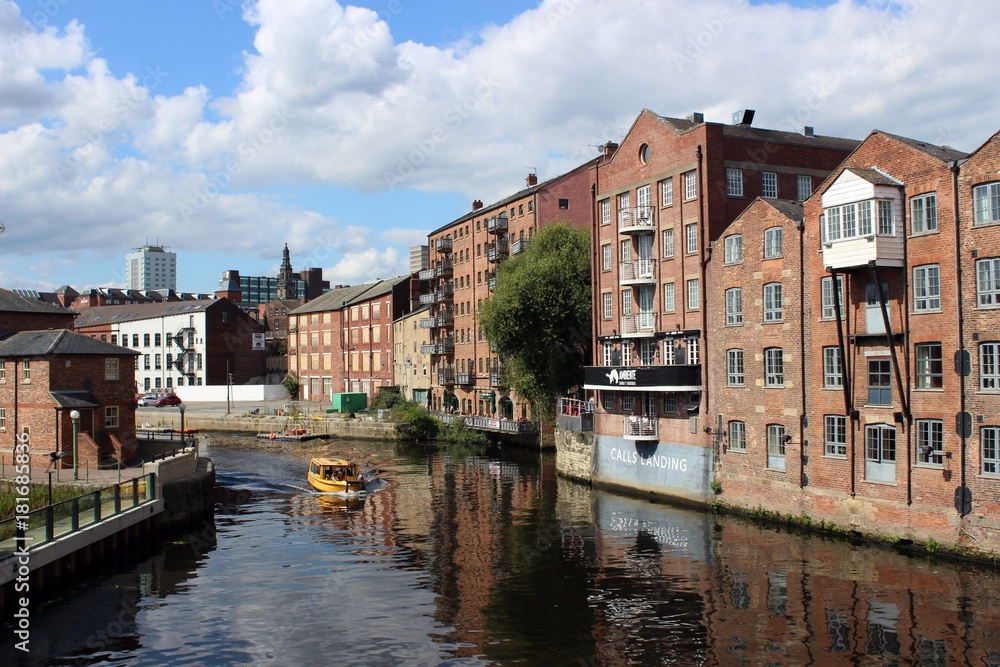 Naklejka premium Historic warehouses beside the River Aire, Leeds.
