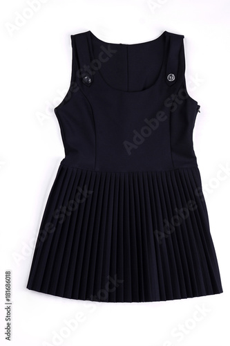 Black sleeveless pleated dress. Girls school dress isolated on white bakground. High quality girls school dress on sale.