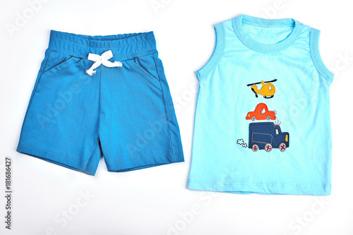 Baby-boy cotton shorts and t-shirt. Set of natural cotton apparel for baby-boy, white background. Collection of new summer clothes for infant boys on sale. © DenisProduction.com