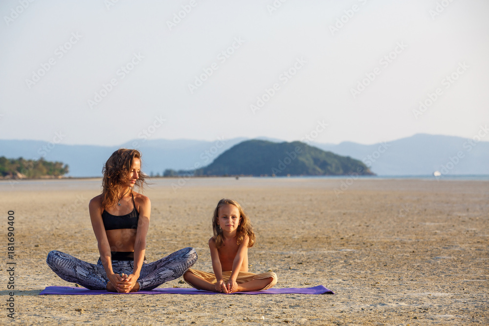 Mother with her son doing yoga