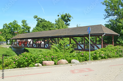 The covered bridge gallery in summer day. Braniewo, Poland photo