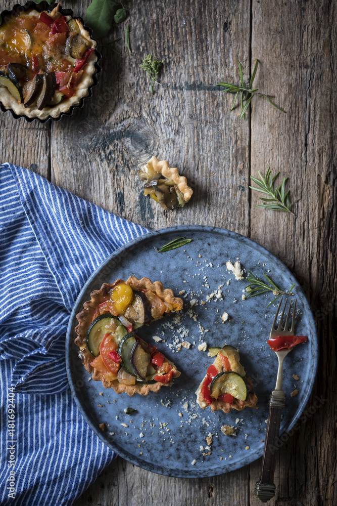 Vegetarian pastry tarts in a rustic kitchen Vegetarian pastry tarts in a rustic kitchen