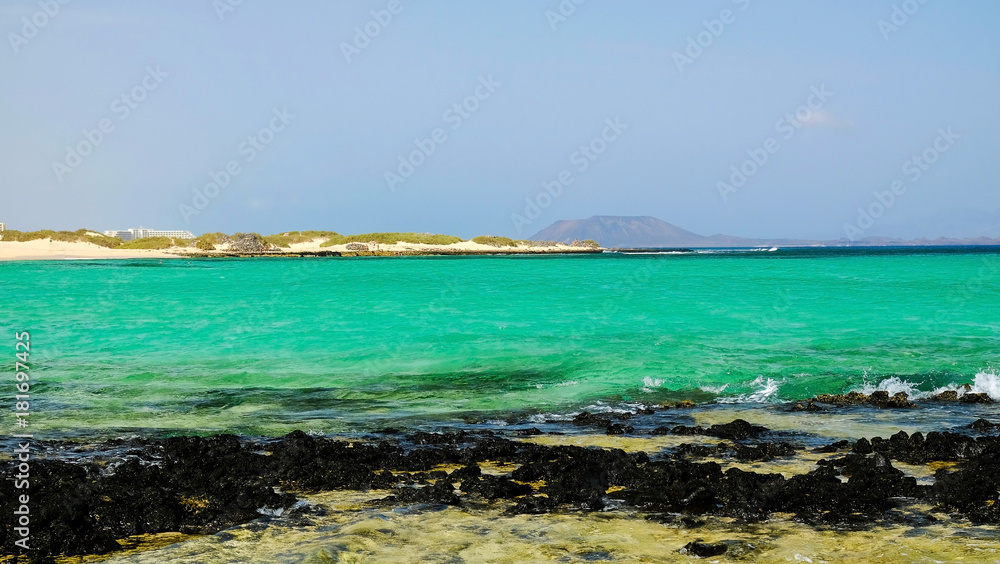 View on the beach Corralejo and island Lobos.