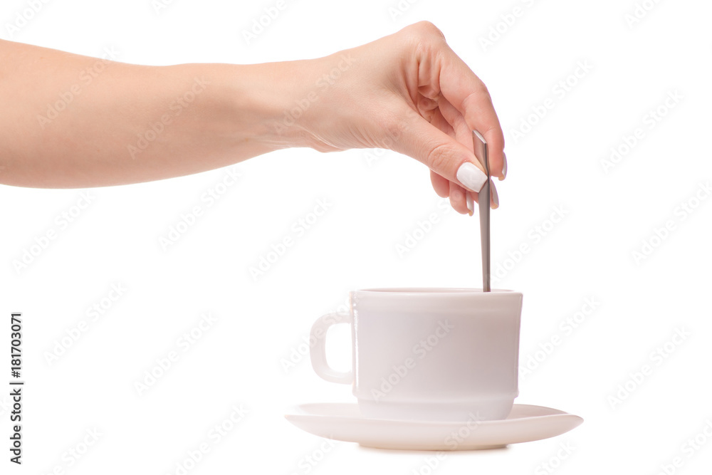 Cup and saucer with a teaspoon in hands tea coffee Cup and saucer with a teaspoon in hands tea coffee