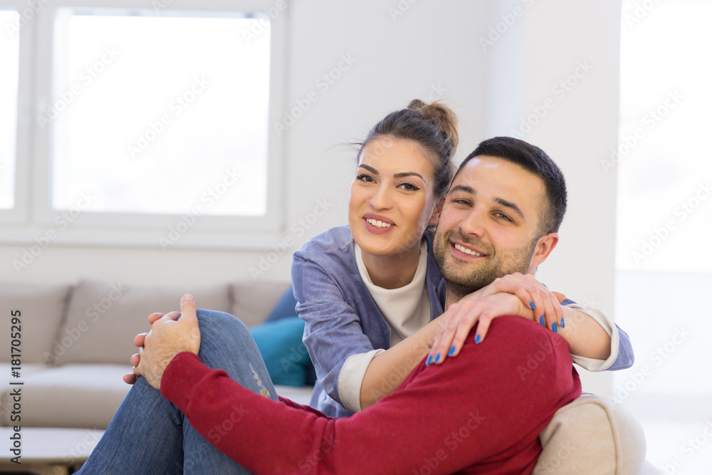 couple hugging and relaxing on sofa couple hugging and relaxing on sofa