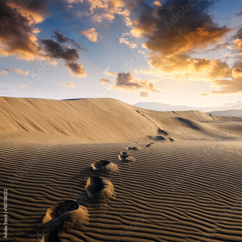 Footprints on sand in the desert
