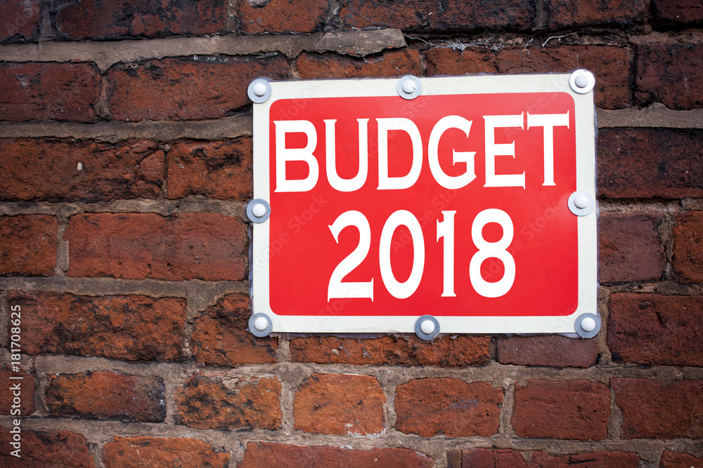 Obraz premium Hand writing text caption inspiration showing Budget 2018 concept meaning New Year Budget Financial Concept written on old announcement road sign with background and copy space