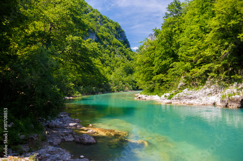 mountain river with crystal clear water among the green mountains