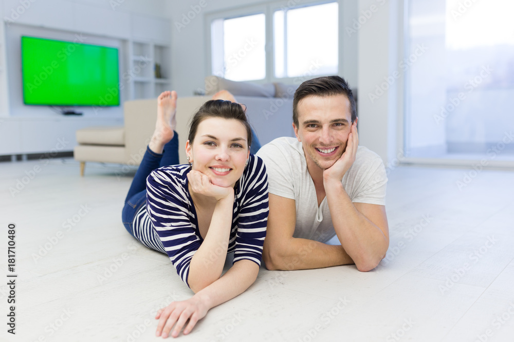 couple lying on the floor at home couple lying on the floor at home