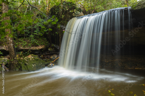 View of peaceful waterfall in the tropical rainforest  waterfall in Phu Kradueng National Park  Loei Province  Thailand