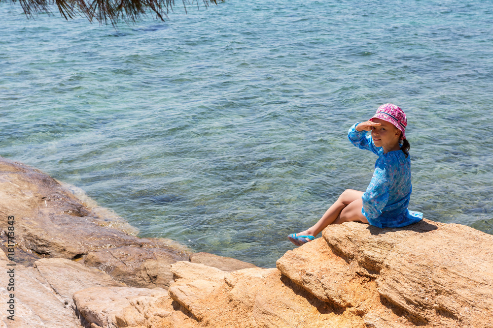 Tourist young girl on Aegean coast of Sithonia peninsula Tourist young girl on Aegean coast of Sithonia peninsula