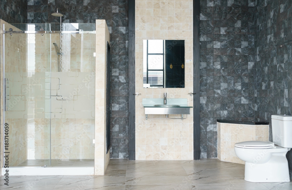 Spacious and bright modern bathroom interior with white walls, a shower ...