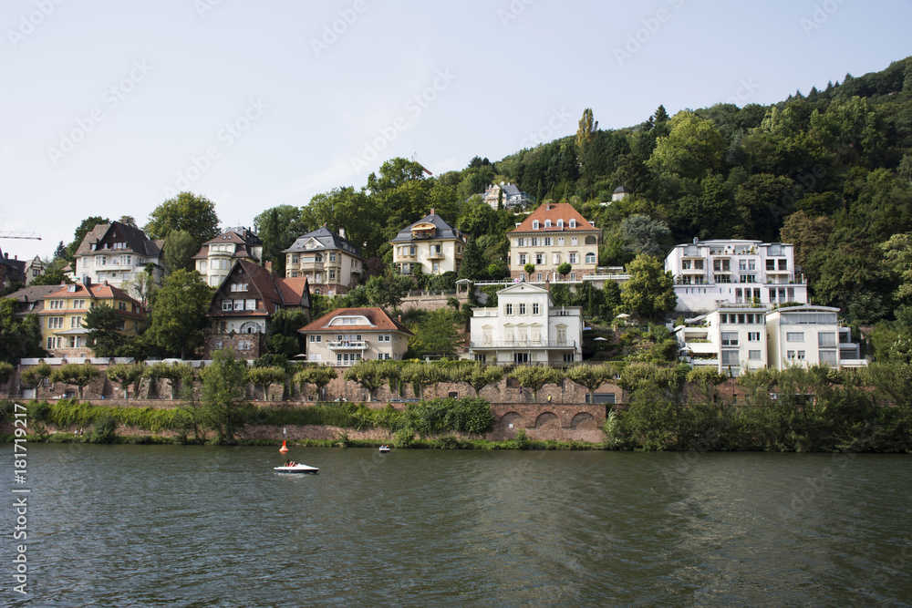 Classic and modern building for people living at riverside of Neckar River near heidelberger square