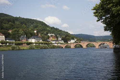 German and foreigner travelers walking and visit on Karl Theodor Bridge or Old Bridge of Heidelberg cross over Neckar River